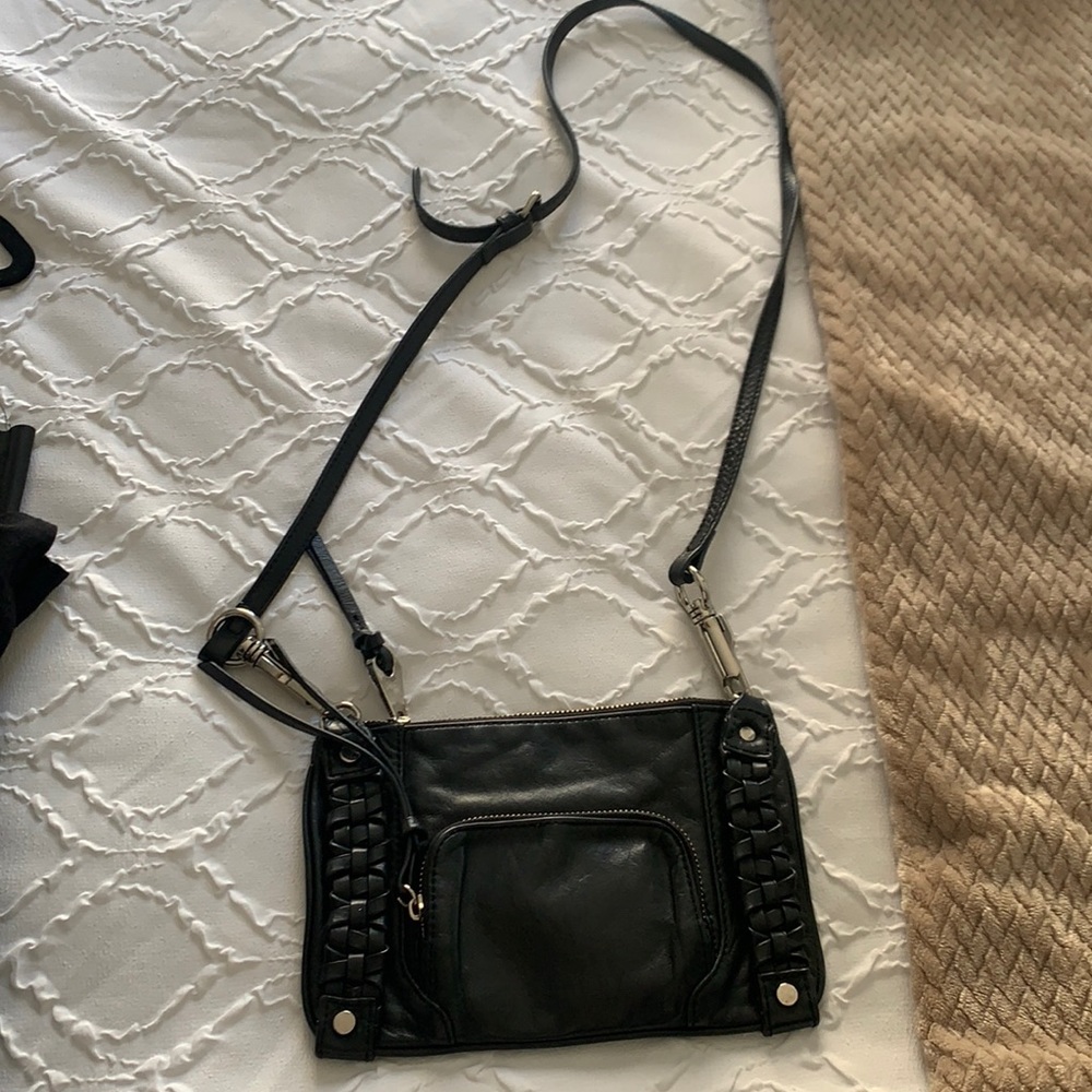 Small black purse by Joelle Hawkins.